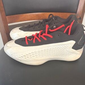 AE1s
adidas Black and White Sneakers with Red Accents